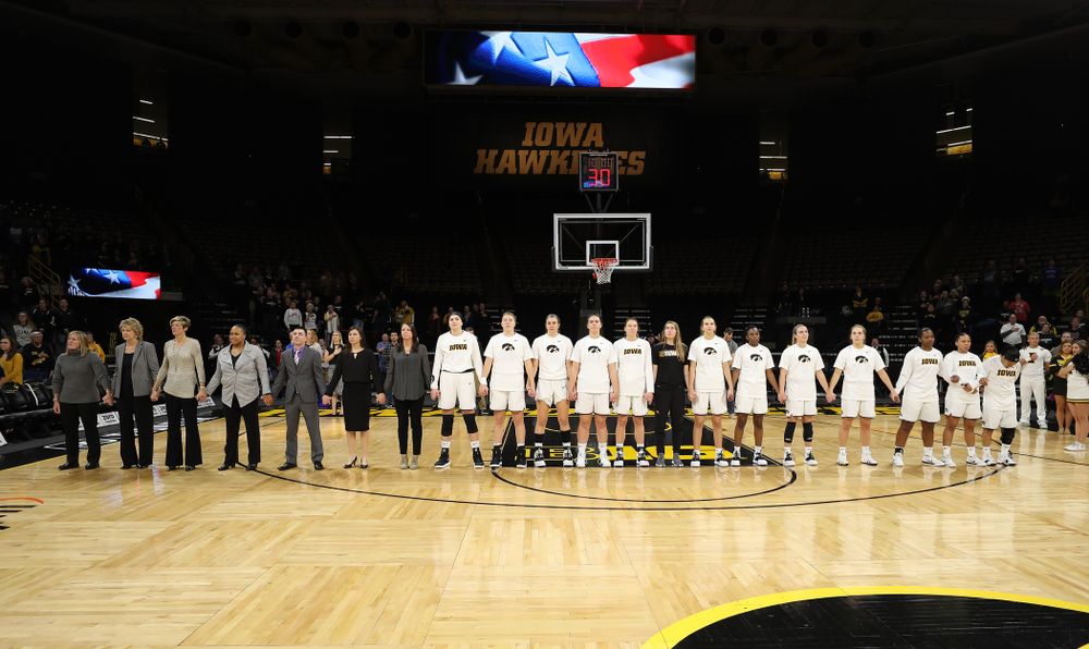 The Iowa Hawkeyes stand for the National Anthem before their game against the Wisconsin Badgers Monday, January 7, 2019 at Carver-Hawkeye Arena.  (Brian Ray/hawkeyesports.com)