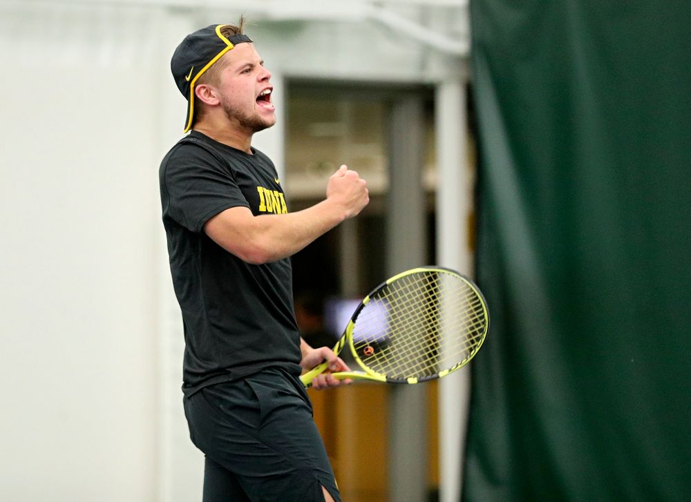 Iowa’s Will Davies celebrates after winning his match at the Hawkeye Tennis and Recreation Complex in Iowa City on Thursday, January 16, 2020. (Stephen Mally/hawkeyesports.com)
