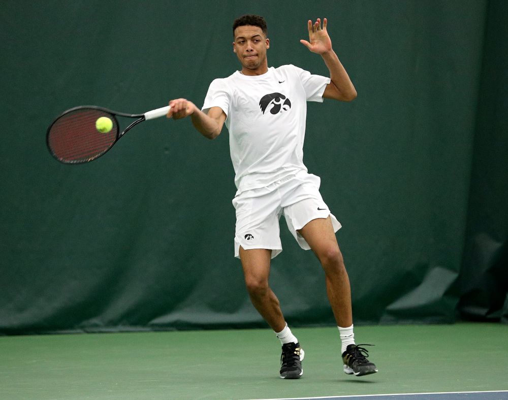 Iowa’s Oliver Okonkwo returns a shot during his singles match at the Hawkeye Tennis and Recreation Complex in Iowa City on Sunday, February 16, 2020. (Stephen Mally/hawkeyesports.com)