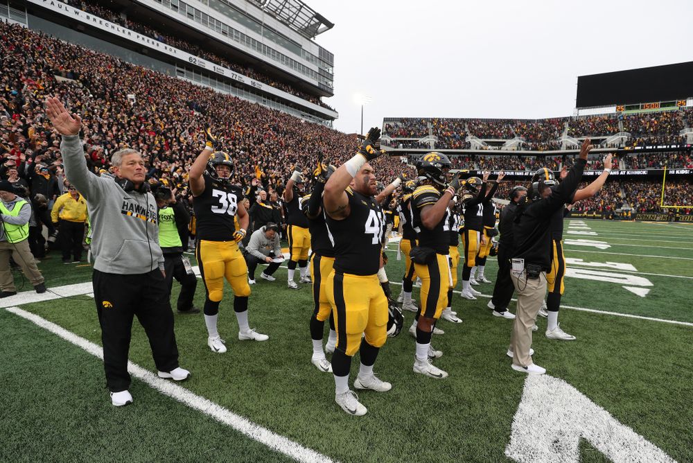 The Iowa Hawkeyes wave to the kids in the Stead Family Children's Hospital at the end of the first quarter of their game against the Nebraska Cornhuskers Friday, November 23, 2018 at Kinnick Stadium. (Brian Ray/hawkeyesports.com)