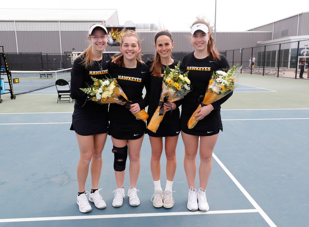 Iowa seniors Montana Crawford, Zoe Douglas, Adrienne Jensen, and Anastasia Reimchen during Senior Day activities before their match against the Wisconsin Badgers Sunday, April 22, 2018 at the Hawkeye Tennis and Recreation Center. (Brian Ray/hawkeyesports.com)