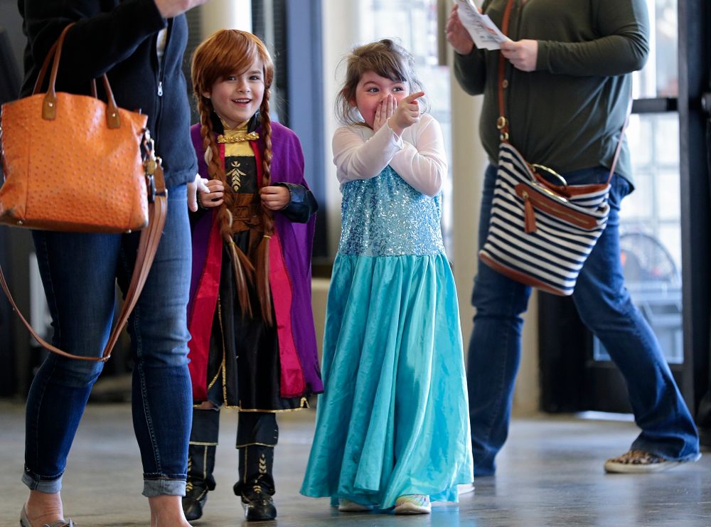 Two young fans react after seeing the princesses on Superhero and Princess Day before the meet at Carver-Hawkeye Arena in Iowa City on Sunday, March 8, 2020. (Stephen Mally/hawkeyesports.com)