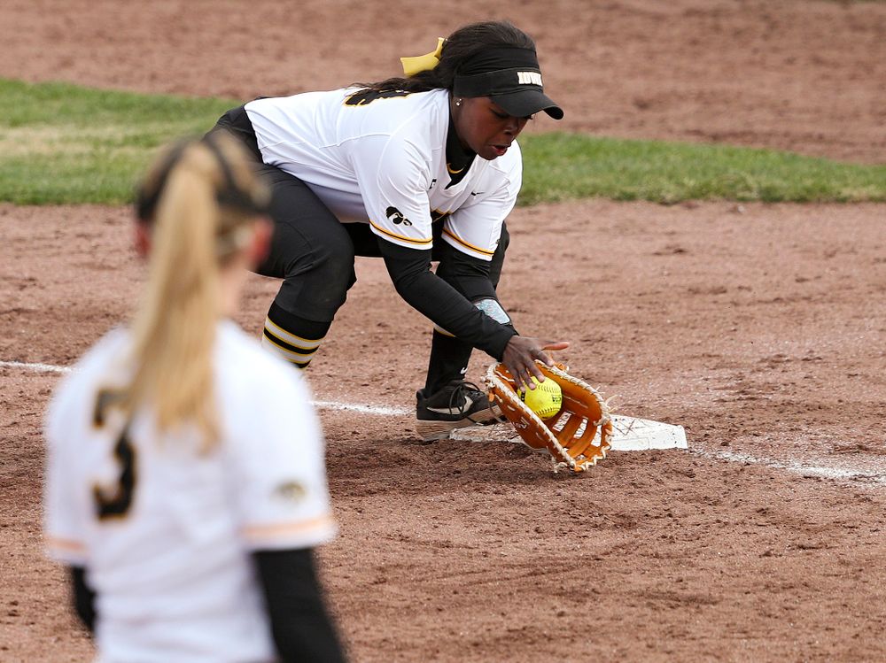 Iowa first baseman DoniRae Mayhew (24) fields a ground ball hit down the line during the fourth inning of their game against Illinois at Pearl Field in Iowa City on Friday, Apr. 12, 2019. (Stephen Mally/hawkeyesports.com)