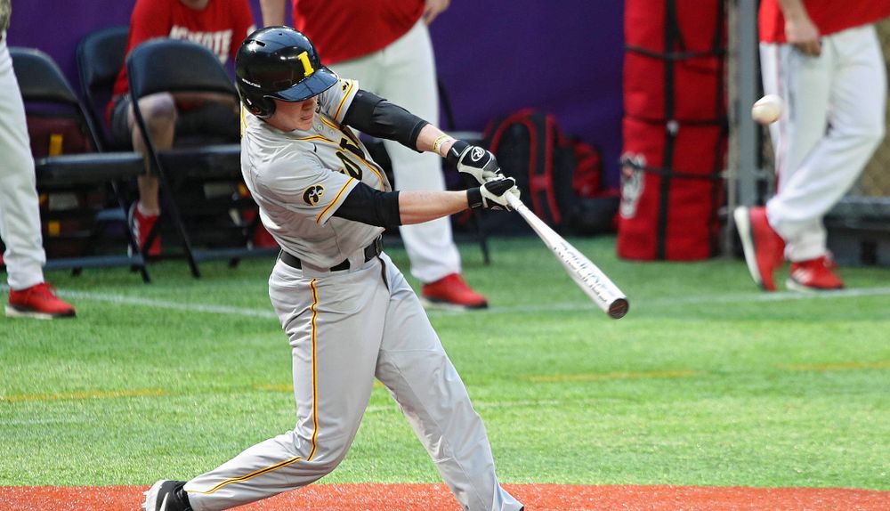 Iowa Hawkeyes utility player Sam Link (3) hits a sacrifice fly to drive in a run during the fifth inning of their CambriaCollegeClassic game at U.S. Bank Stadium in Minneapolis, Minn. on Friday, February 28, 2020. (Stephen Mally/hawkeyesports.com)