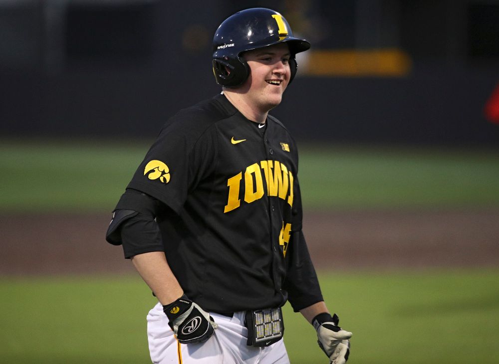 Iowa first baseman Peyton Williams (45) smiles after hitting a triple during the sixth inning of their game at Duane Banks Field in Iowa City on Tuesday, March 3, 2020. (Stephen Mally/hawkeyesports.com)