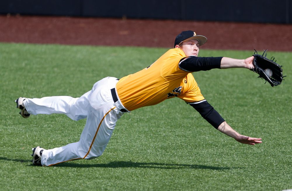 Iowa Hawkeyes outfielder Robert Neustrom (44) makes a diving catch during a game against Evansville at Duane Banks Field on March 18, 2018. (Tork Mason/hawkeyesports.com)