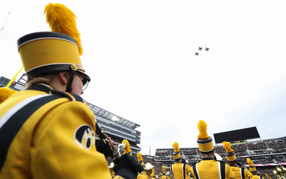 Three F-18 Hornets fly over the stadium as the Hawkeye Marching Band performs the National Anthem before a game against Northwestern at Kinnick Stadium on November 10, 2018. (Tork Mason/hawkeyesports.com)