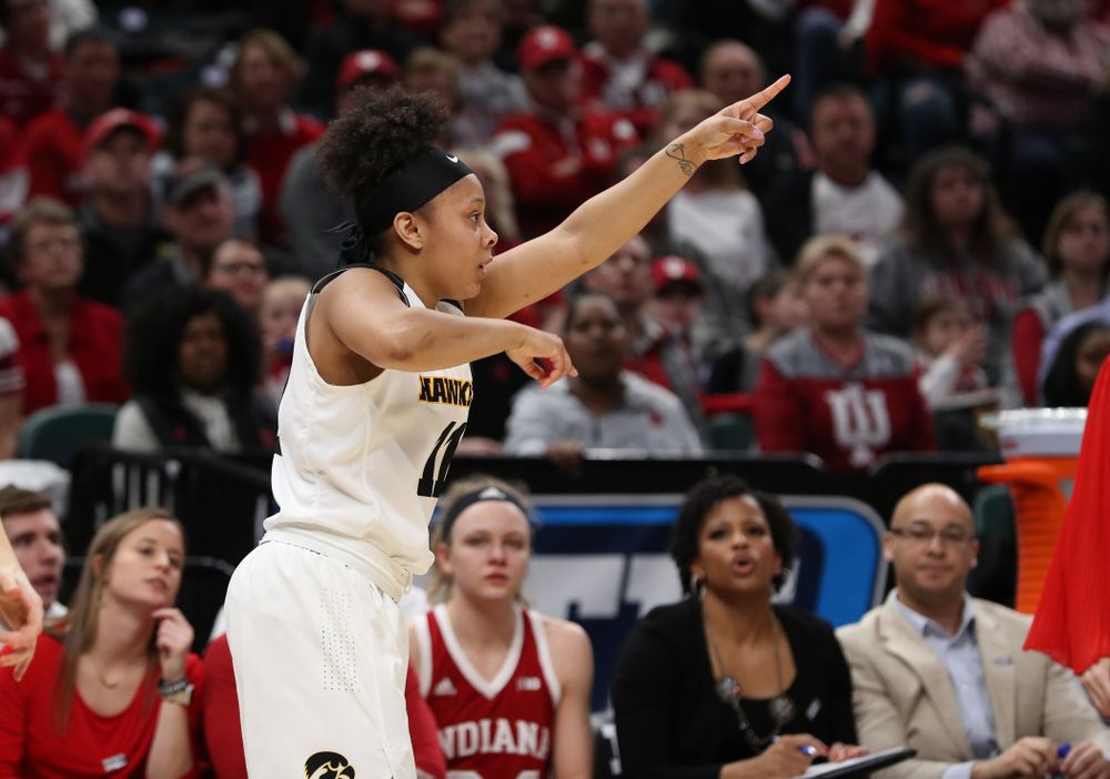 Iowa Hawkeyes guard Tania Davis (11) knocks down a three point basket against the Indiana Hoosiers in the quarterfinals of the Big Ten Tournament Friday, March 8, 2019 at Bankers Life Fieldhouse in Indianapolis, Ind. (Brian Ray/hawkeyesports.com)