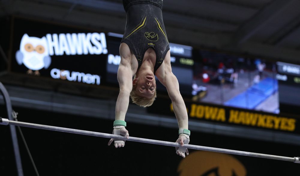 Iowa's Nick Merryman competes on the high bar against the Ohio State Buckeyes Saturday, March 16, 2019 at Carver-Hawkeye Arena.  (Brian Ray/hawkeyesports.com)