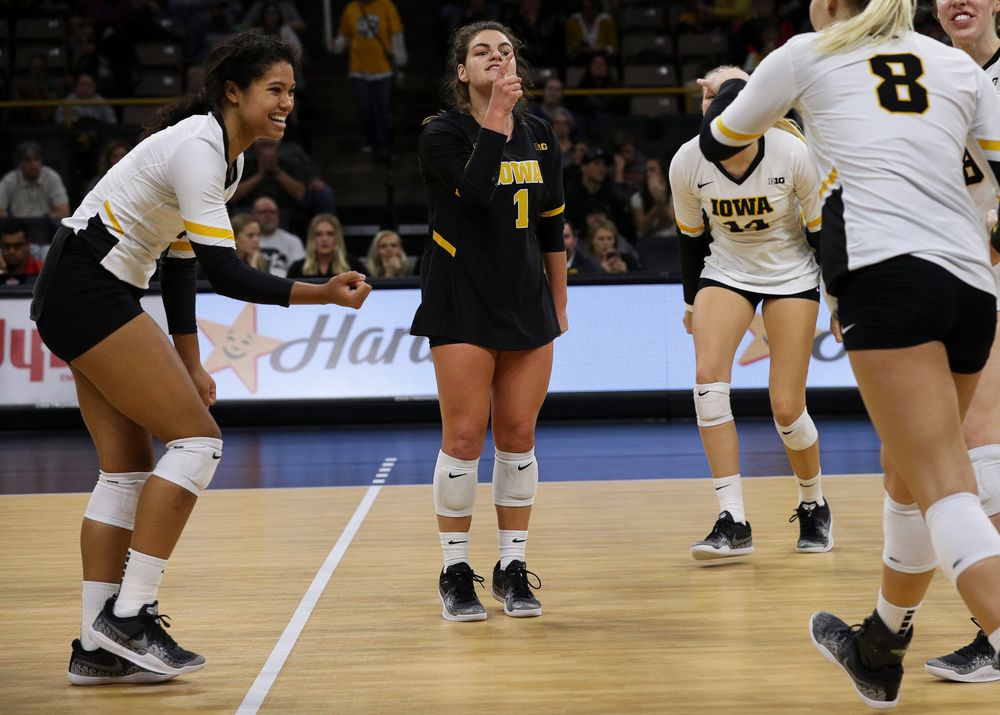 Iowa Hawkeyes setter Brie Orr (7) and Iowa Hawkeyes defensive specialist Molly Kelly (1) celebrate after winning a point during a match against Rutgers at Carver-Hawkeye Arena on November 2, 2018. (Tork Mason/hawkeyesports.com)