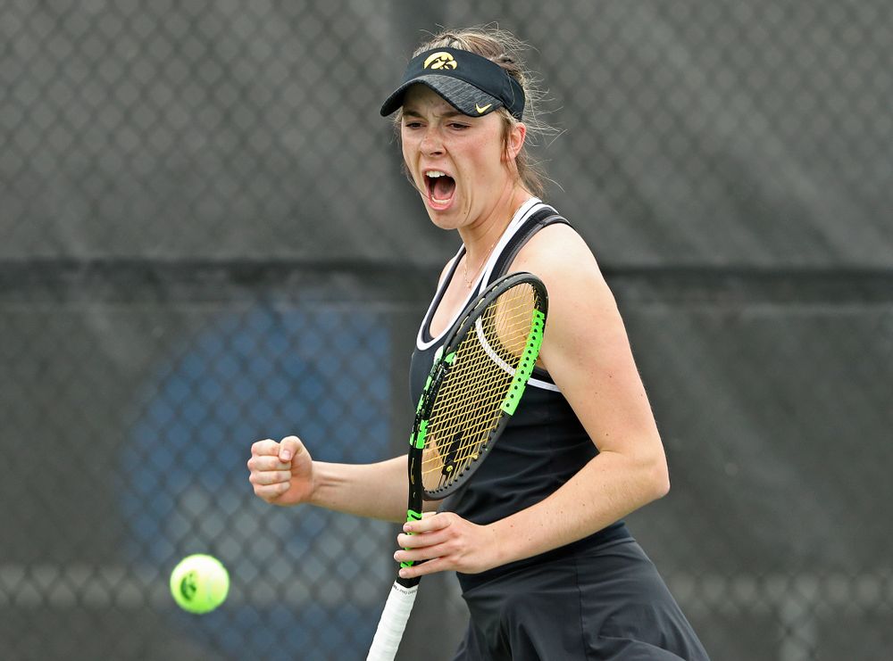 Iowa's Samantha Mannix celebrates as she watches the ball drop out of bounds during their doubles match against Rutgers at the Hawkeye Tennis and Recreation Complex in Iowa City on Friday, Apr. 5, 2019. (Stephen Mally/hawkeyesports.com)