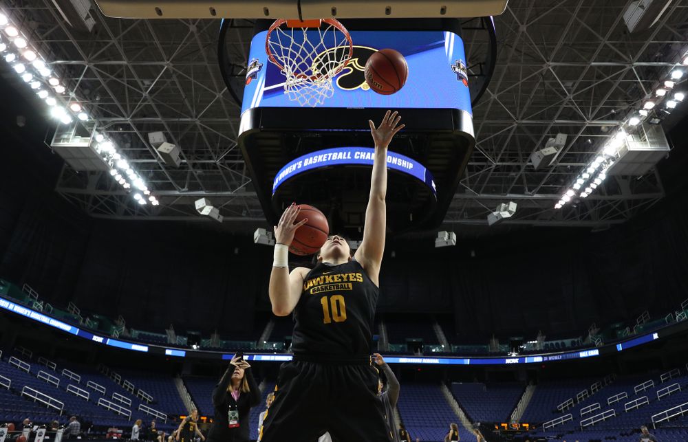 Iowa Hawkeyes forward Megan Gustafson (10) does the Mikan Drill the ESPN Crew following practice for their Sweet 16 matchup against NC State Friday, March 29, 2019 at the Greensboro Coliseum in Greensboro, NC.(Brian Ray/hawkeyesports.com)