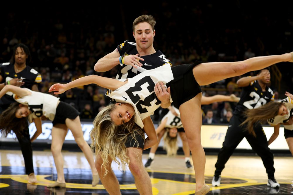 Members of the Hawkeye Football team performs with the Iowa Dance Team at halftime of the Iowa Hawkeyes game against the Ohio State Buckeyes Thursday, February 20, 2020 at Carver-Hawkeye Arena. (Brian Ray/hawkeyesports.com)