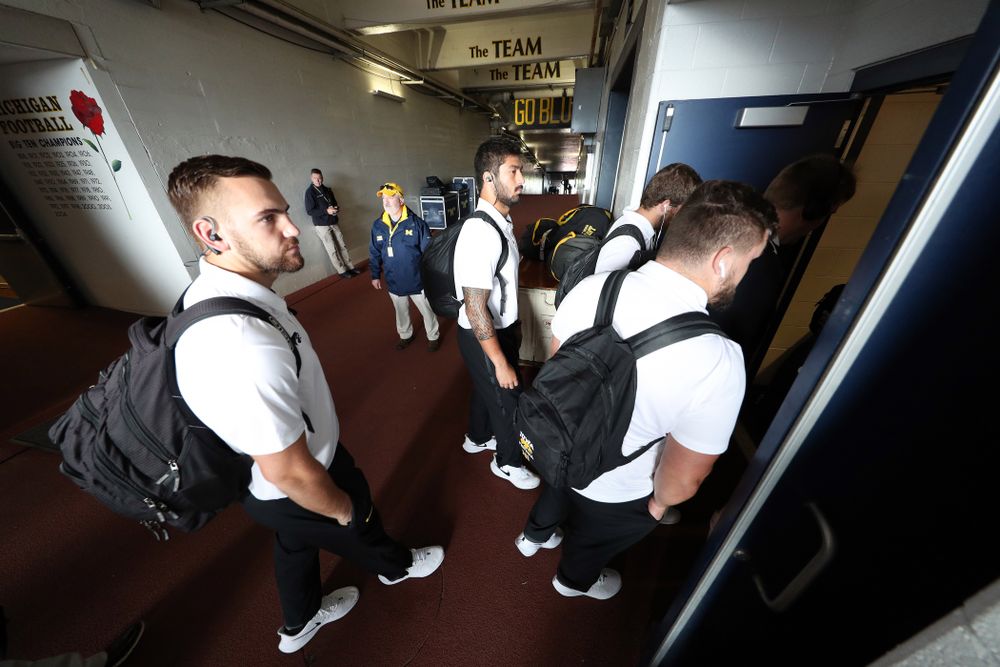 Iowa Hawkeyes defensive end A.J. Epenesa (94) and tight end Nate Wieting (39) arrive for their game against the Michigan Wolverines Saturday, October 5, 2019 at Michigan Stadium in Ann Arbor, MI. (Brian Ray/hawkeyesports.com)
