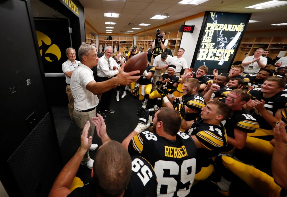 Iowa Hawkeyes head coach Kirk Ferentz  celebrates his historic victory with his team following their game against the Northern Illinois Huskies Saturday, September 1, 2018 at Kinnick Stadium. (Brian Ray/hawkeyesports.com)