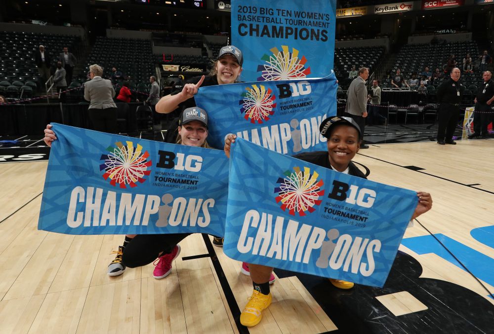 Iowa Hawkeyes guard Kathleen Doyle (22), guard Makenzie Meyer (3), and guard Zion Sanders (24)  celebrate their victory over the Maryland Terrapins in the Big Ten Championship Game Sunday, March 10, 2019 at Bankers Life Fieldhouse in Indianapolis, Ind. (Brian Ray/hawkeyesports.com)