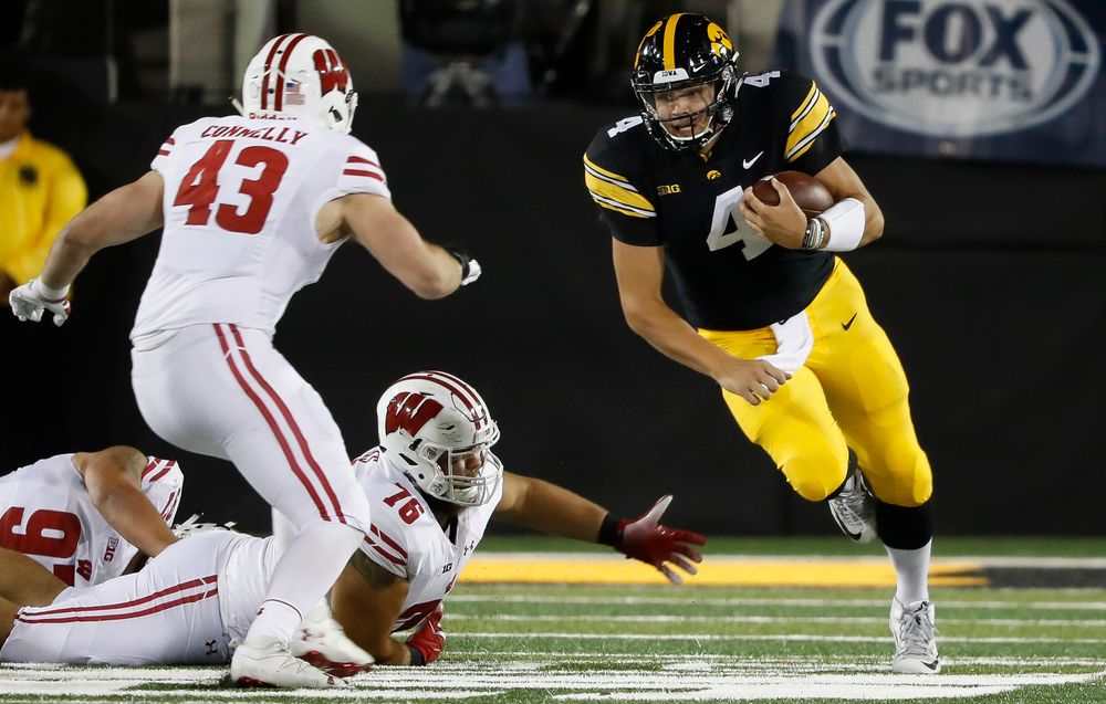 Iowa Hawkeyes quarterback Nate Stanley (4) runs the ball during a game against Wisconsin at Kinnick Stadium on September 22, 2018. (Tork Mason/hawkeyesports.com)