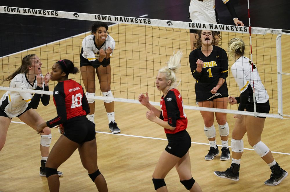 Iowa Hawkeyes setter Brie Orr (7) and Iowa Hawkeyes defensive specialist Molly Kelly (1) celebrate after winning a point during a match against Rutgers at Carver-Hawkeye Arena on November 2, 2018. (Tork Mason/hawkeyesports.com)