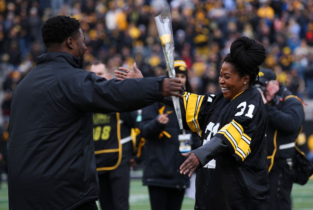 Iowa Hawkeyes linebacker Aaron Mends (31) is greeted by his mother during Senior Day ceremonies before a game against Nebraska at Kinnick Stadium on November 23, 2018. (Tork Mason/hawkeyesports.com)