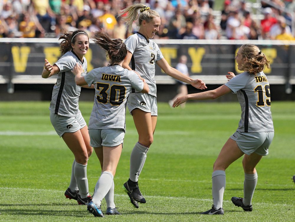 Iowa forward Kaleigh Haus (4), forward Devin Burns (30), midfielder Hailey Rydberg (2), and forward Jenny Cape (19) celebrates after Haus scored a goal during the first half of their match at the Iowa Soccer Complex in Iowa City on Sunday, Sep 1, 2019. (Stephen Mally/hawkeyesports.com)