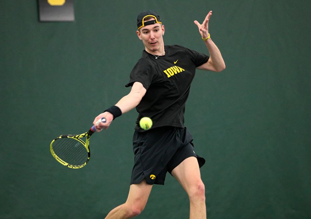 Iowa’s Nikita Snezhko returns a shot during his singles match at the Hawkeye Tennis and Recreation Complex in Iowa City on Friday, February 14, 2020. (Stephen Mally/hawkeyesports.com)