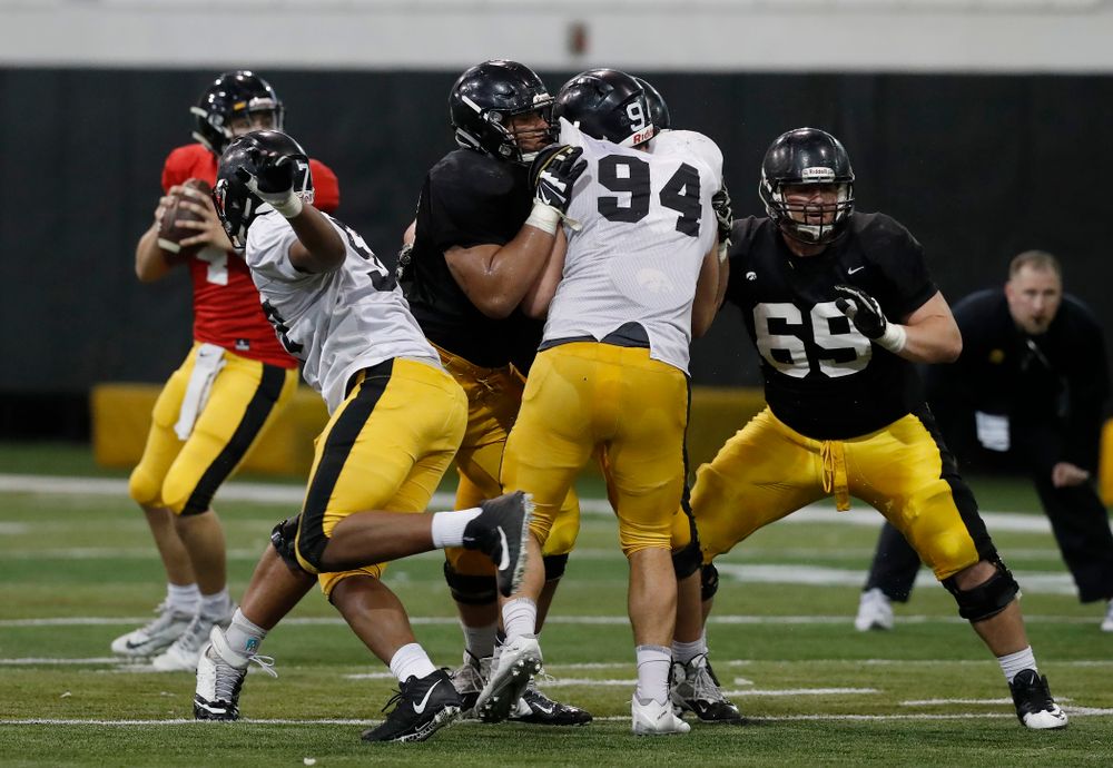 Iowa Hawkeyes offensive lineman Tristan Wirfs (74), offensive lineman Keegan Render (69), and defensive end A.J. Epenesa (94) during spring practice No. 13 Wednesday, April 18, 2018 at the Hansen Football Performance Center. (Brian Ray/hawkeyesports.com)