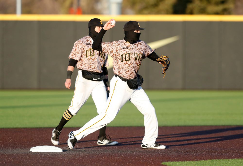 Iowa Hawkeyes infielder Mitchell Boe (4) and infielder Kyle Crowl (23) against the Ohio State Buckeyes Saturday, April 7, 2018 at Duane Banks Field. (Brian Ray/hawkeyesports.com)