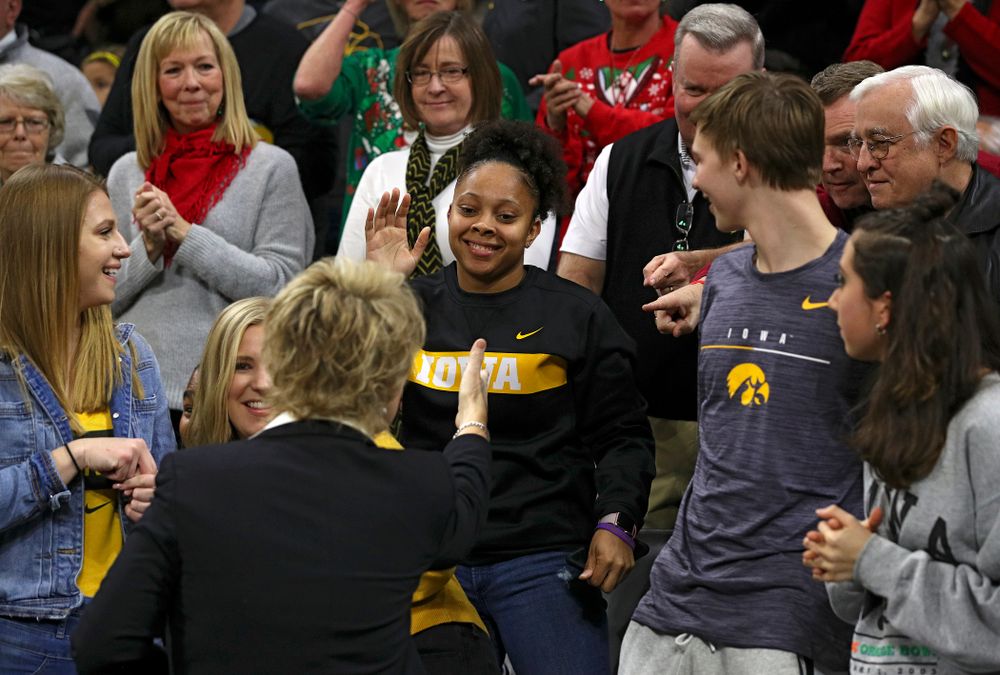Former Iowa Hawkeyes player Tania Davis shakes hands with head coach Lisa Bluder before their game at Carver-Hawkeye Arena in Iowa City on Saturday, December 21, 2019. (Stephen Mally/hawkeyesports.com)