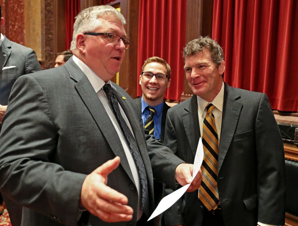 State Sen. Dan Zumbach (from left) talks with Iowa's Spencer Lee and head coach Tom Brands in the Senate Chamber at the Iowa State Capitol Building on Tuesday, Apr. 9, 2019. (Stephen Mally/hawkeyesports.com)