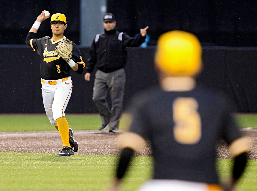Iowa Hawkeyes third baseman Matthew Sosa (31) throw to first baseman Zeb Adreon (5) for an out during the ninth inning of their game against Illinois State at Duane Banks Field in Iowa City on Wednesday, Apr. 3, 2019. (Stephen Mally/hawkeyesports.com)