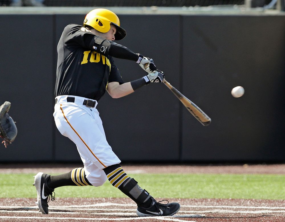 Iowa Hawkeyes second baseman Mitchell Boe (4) hits an RBI double during the first inning of their game against Rutgers at Duane Banks Field in Iowa City on Saturday, Apr. 6, 2019. (Stephen Mally/hawkeyesports.com)