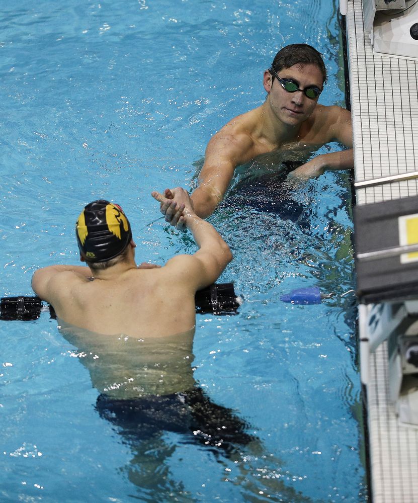 Iowa's Michael Tenney congratulates teammate Anze Fers Erzen after finishing the 400-yard IM during the third day of the Hawkeye Invitational at the Campus Recreation and Wellness Center on November 16, 2018. (Tork Mason/hawkeyesports.com)
