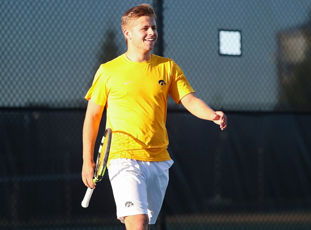 Iowa's Will Davies smiles during his match again Michigan State at the Hawkeye Tennis and Recreation Complex in Iowa City on Friday, Apr. 19, 2019. (Stephen Mally/hawkeyesports.com)