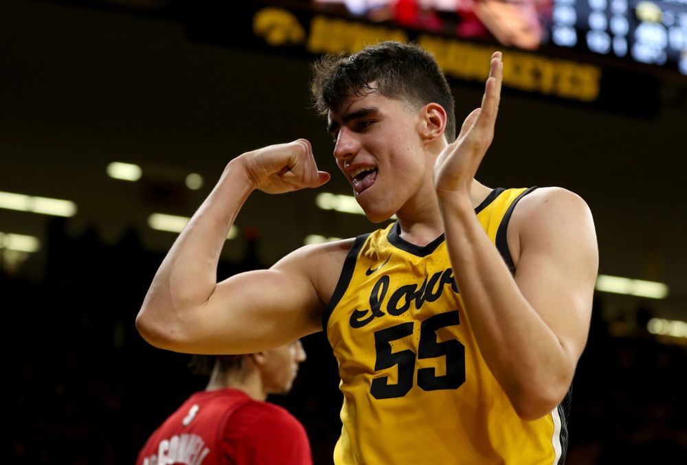 Iowa Hawkeyes forward Luka Garza (55) flexes after making a basket and drawing a foul against the Rutgers Scarlet Knights  Wednesday, January 22, 2020 at Carver-Hawkeye Arena. (Brian Ray/hawkeyesports.com)