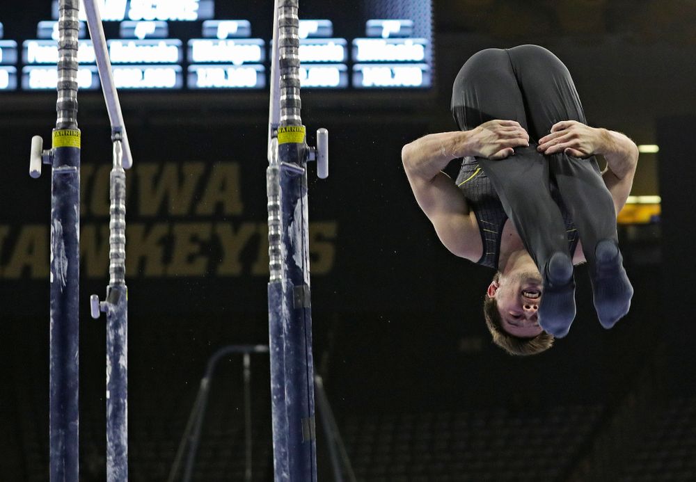 Iowa's Rogelio Vazquez competes in the parallel bars during the first day of the Big Ten Men's Gymnastics Championships at Carver-Hawkeye Arena in Iowa City on Friday, Apr. 5, 2019. (Stephen Mally/hawkeyesports.com)