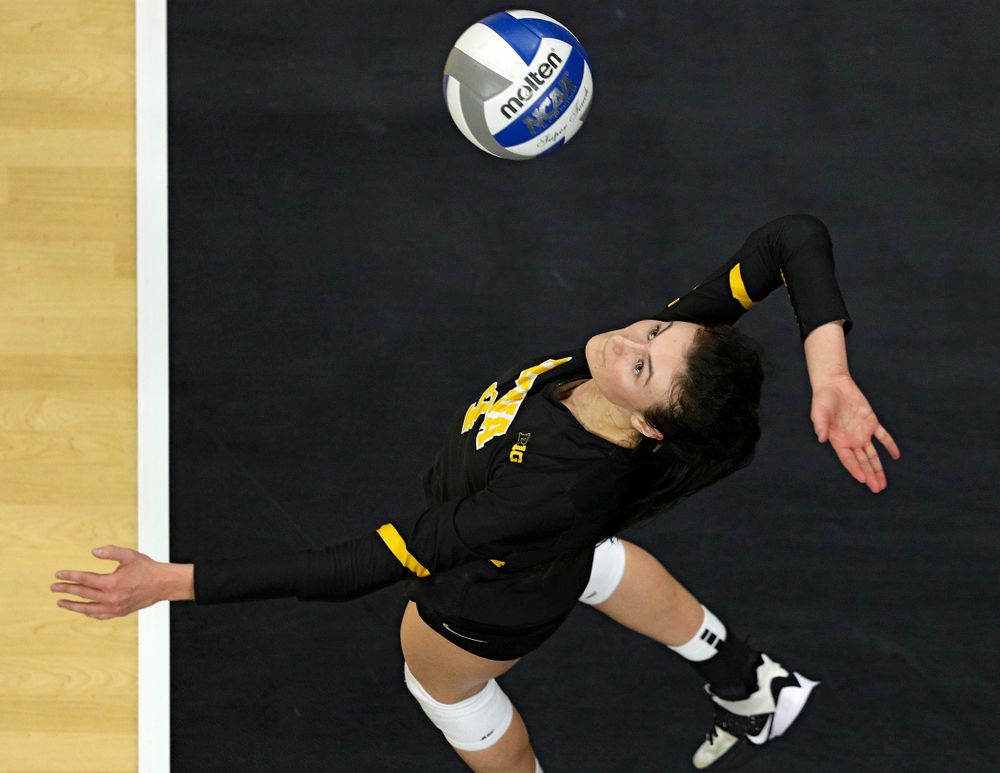 Iowa’s Halle Johnston (4) serves the ball during the fourth set of their match at Carver-Hawkeye Arena in Iowa City on Friday, Nov 29, 2019. (Stephen Mally/hawkeyesports.com)