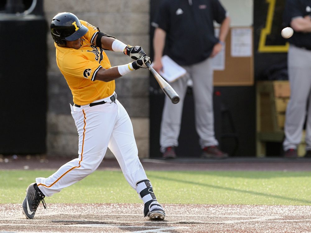 Iowa Hawkeyes first baseman Izaya Fullard (20) drives in a run with a sacrifice fly during the fourth inning of their game against Northern Illinois at Duane Banks Field in Iowa City on Tuesday, Apr. 16, 2019. (Stephen Mally/hawkeyesports.com)