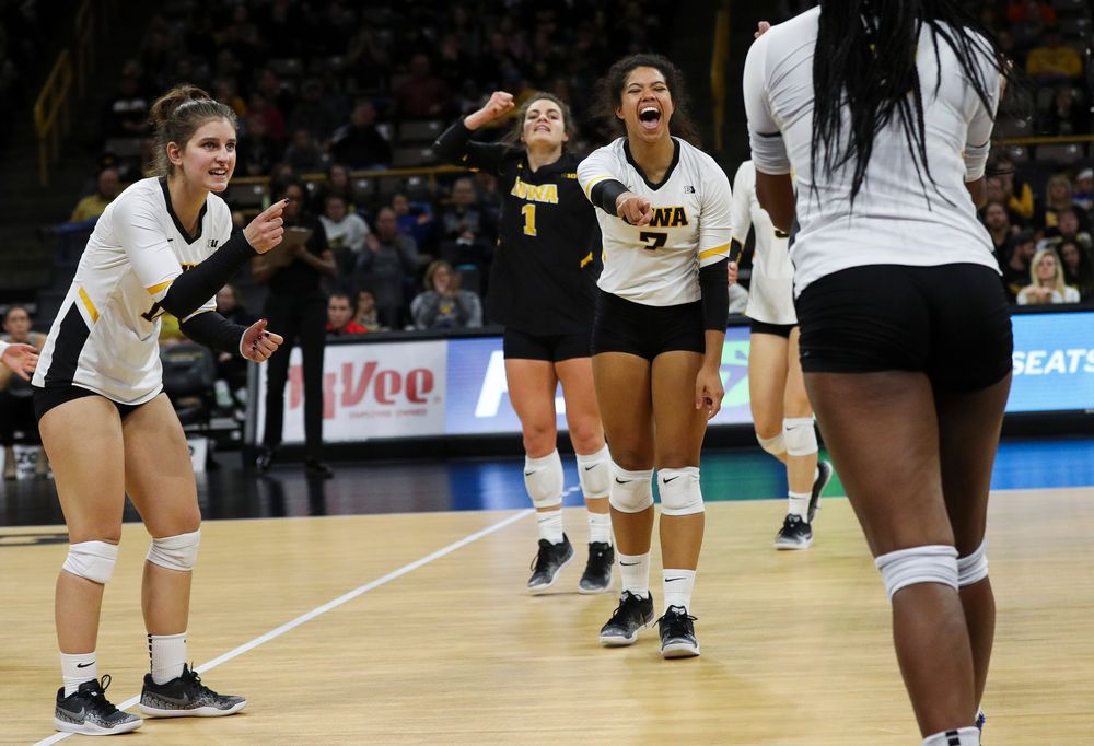 Iowa Hawkeyes defensive specialist Emily Bushman (12) and Iowa Hawkeyes setter Brie Orr (7) celebrate after winning a point during a match against Maryland at Carver-Hawkeye Arena on November 23, 2018. (Tork Mason/hawkeyesports.com)