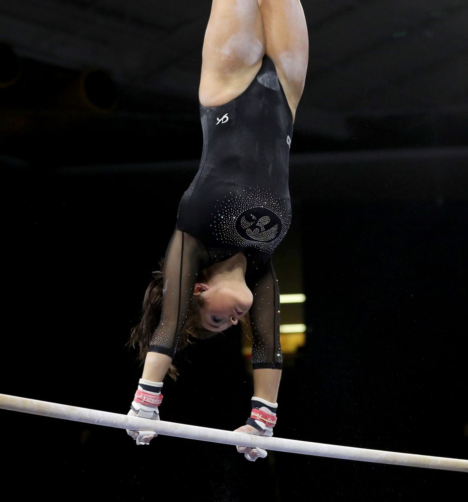 Iowa’s Erin Castle competes on the bars against Michigan Friday, February 14, 2020 at Carver-Hawkeye Arena. (Brian Ray/hawkeyesports.com)