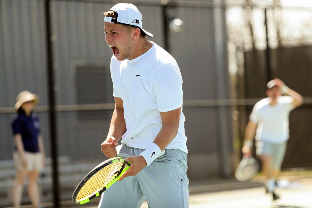 Iowa's Will Davies celebrates after winning his match against Michigan at the Hawkeye Tennis and Recreation Complex in Iowa City on Sunday, Apr. 21, 2019. (Stephen Mally/hawkeyesports.com)