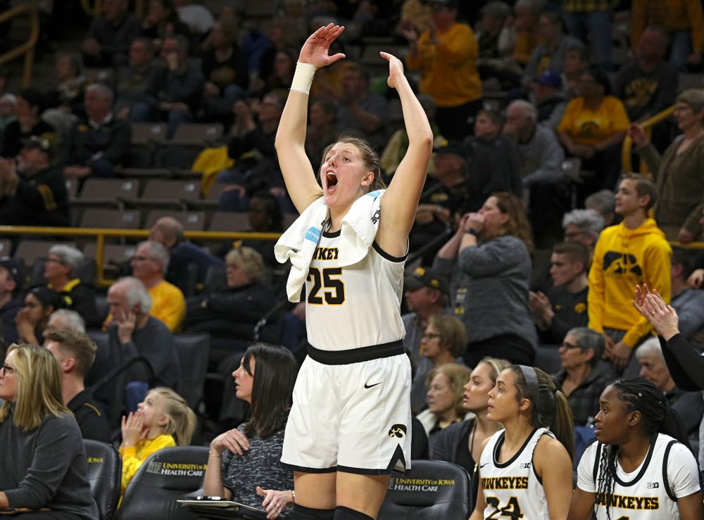 Iowa Hawkeyes forward Monika Czinano (25) pumps up the crowd during the second overtime period of their game at Carver-Hawkeye Arena in Iowa City on Sunday, January 12, 2020. (Stephen Mally/hawkeyesports.com)