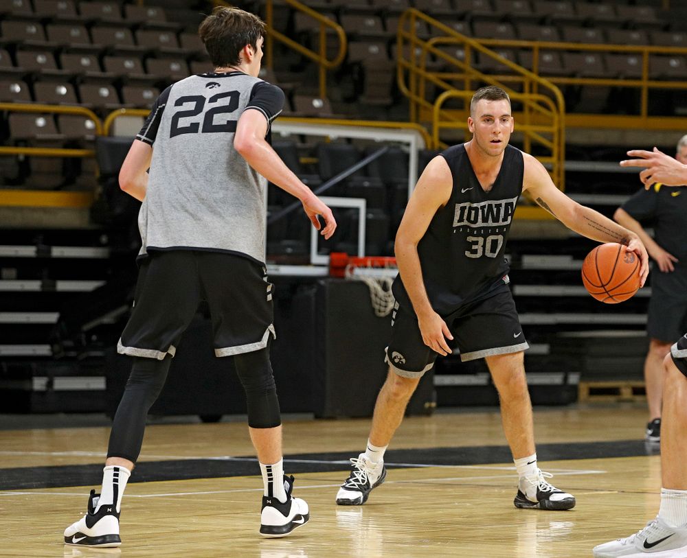 Iowa Hawkeyes guard Connor McCaffery (30) dribbles the ball as forward Patrick McCaffery (22) defends during practice at Carver-Hawkeye Arena in Iowa City on Monday, Sep 30, 2019. (Stephen Mally/hawkeyesports.com)