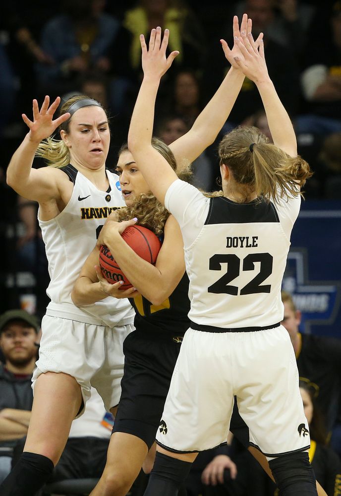 Iowa Hawkeyes forward Hannah Stewart (21) and guard Kathleen Doyle (22) pressure Missouri Tigers forward Hannah Schuchts (13) which led to a turnover during the first quarter of their second round game in the 2019 NCAA Women's Basketball Tournament at Carver Hawkeye Arena in Iowa City on Sunday, Mar. 24, 2019. (Stephen Mally for hawkeyesports.com)