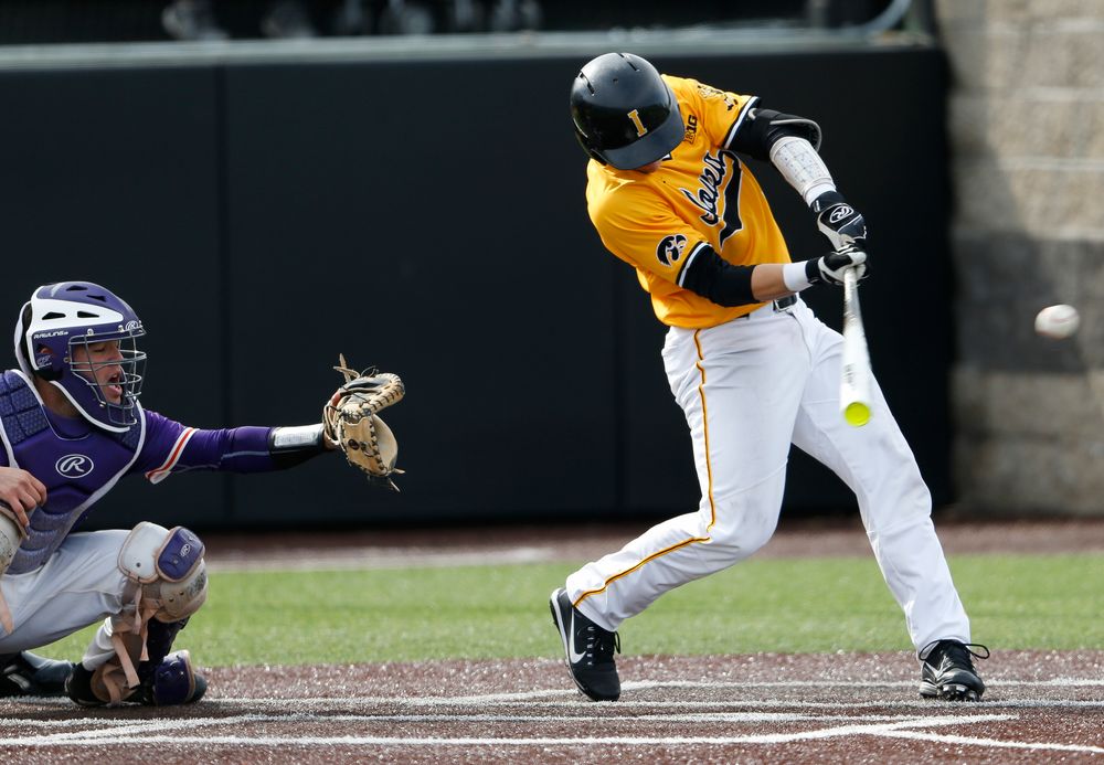Iowa Hawkeyes catcher Tyler Cropley (5) hits an RBI single in the eighth inning during a game against Evansville at Duane Banks Field on March 18, 2018. (Tork Mason/hawkeyesports.com)