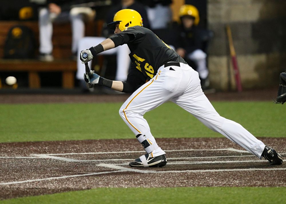 Iowa Hawkeyes shortstop Tanner Wetrich (16) lays down a bunt single during the sixth inning of their game against Western Illinois at Duane Banks Field in Iowa City on Wednesday, May. 1, 2019. (Stephen Mally/hawkeyesports.com)