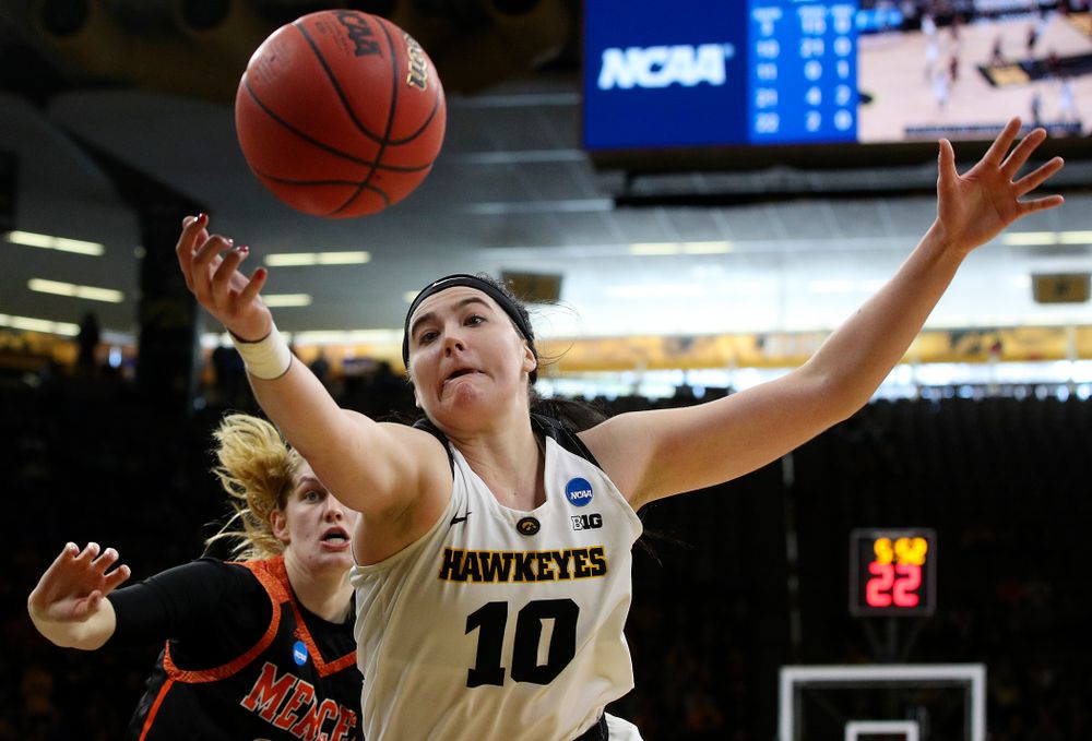 Iowa Hawkeyes forward Megan Gustafson (10) tries to pull in a loose ball during the first round of the 2019 NCAA Women's Basketball Tournament at Carver Hawkeye Arena in Iowa City on Friday, Mar. 22, 2019. (Stephen Mally for hawkeyesports.com)