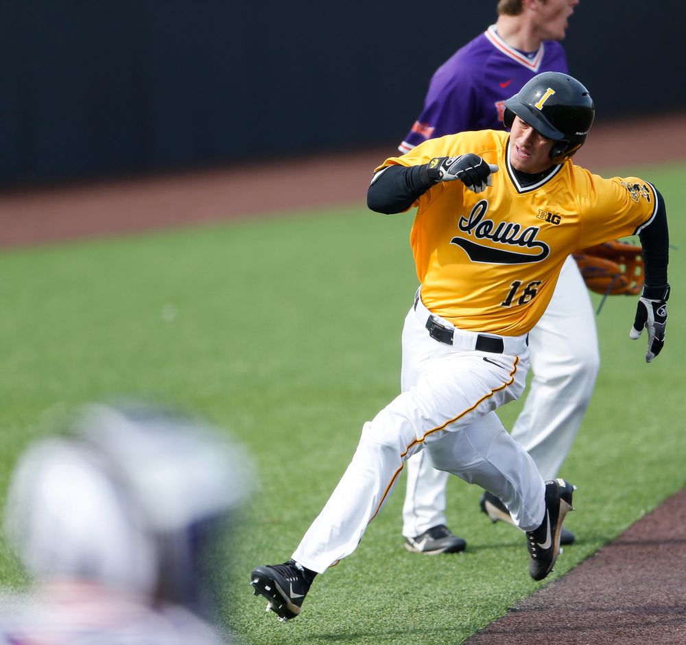 Iowa Hawkeyes outfielder Tanner Wetrich (16) comes home to score the game-tying run in the seventh inning during a game against Evansville at Duane Banks Field on March 18, 2018. (Tork Mason/hawkeyesports.com)