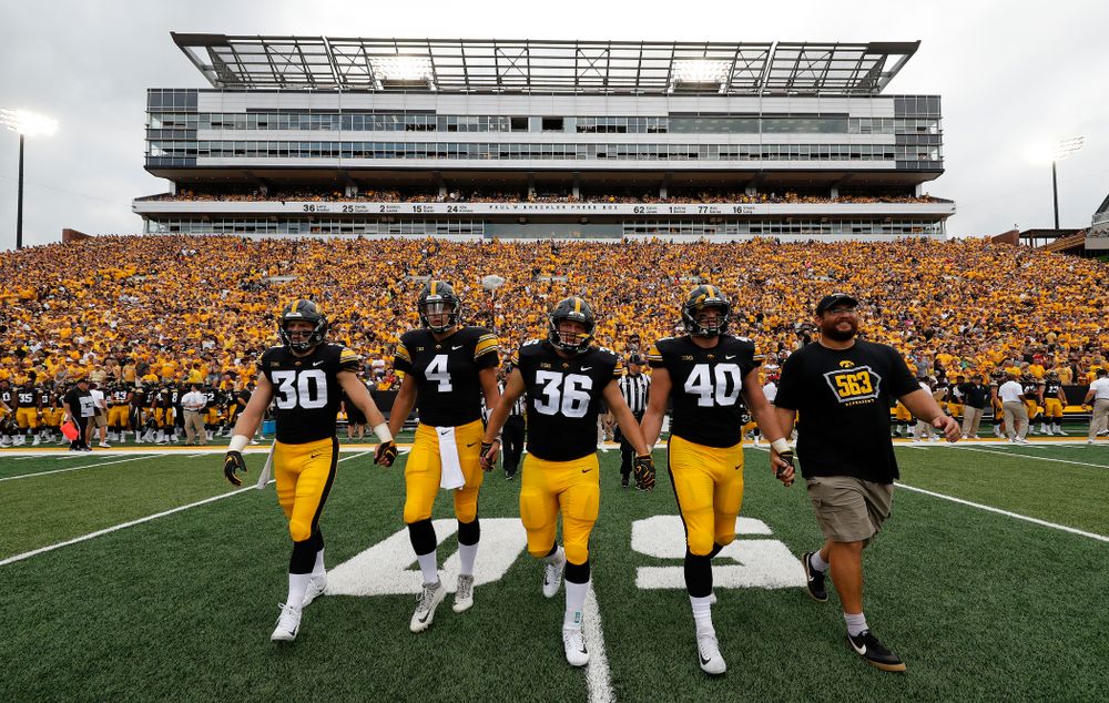 Captains Jake Gervase, Nate Stanley, Brady Ross, Parker Hesse, and Honorary Captain Julian Vandervelde against the Norther Illinois Huskies  Saturday, September 1, 2018 . (Brian Ray/hawkeyesports.com)
