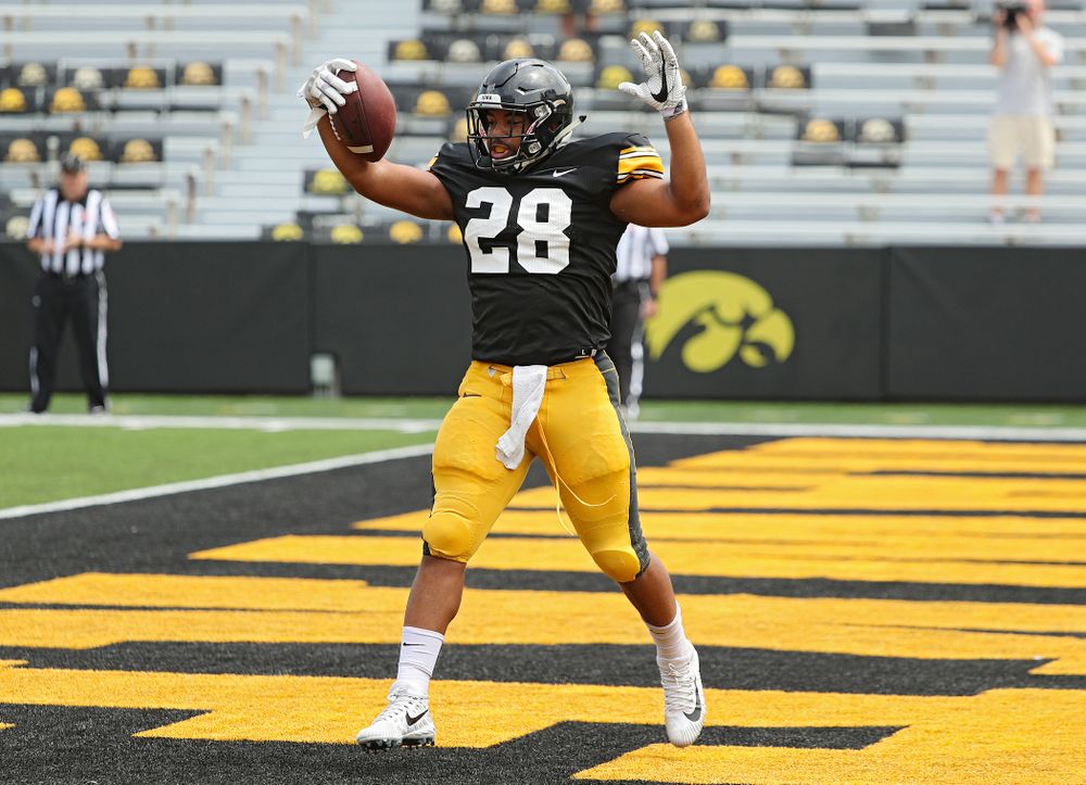 Iowa Hawkeyes running back Toren Young (28) scores a touchdown during Fall Camp Practice No. 8 at Kids Day at Kinnick Stadium in Iowa City on Saturday, Aug 10, 2019. (Stephen Mally/hawkeyesports.com)
