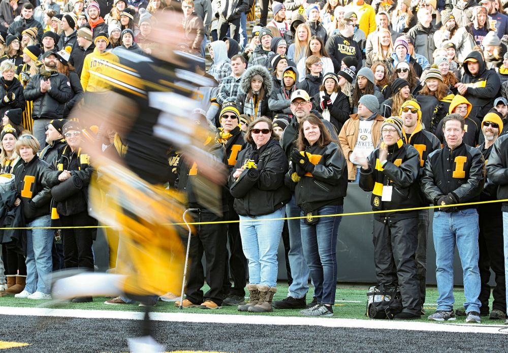 University of Iowa letterwinners form a tunnel as punter Colten Rastetter (7) is acknowledged on senior day before their game at Kinnick Stadium in Iowa City on Saturday, Nov 23, 2019. (Stephen Mally/hawkeyesports.com)